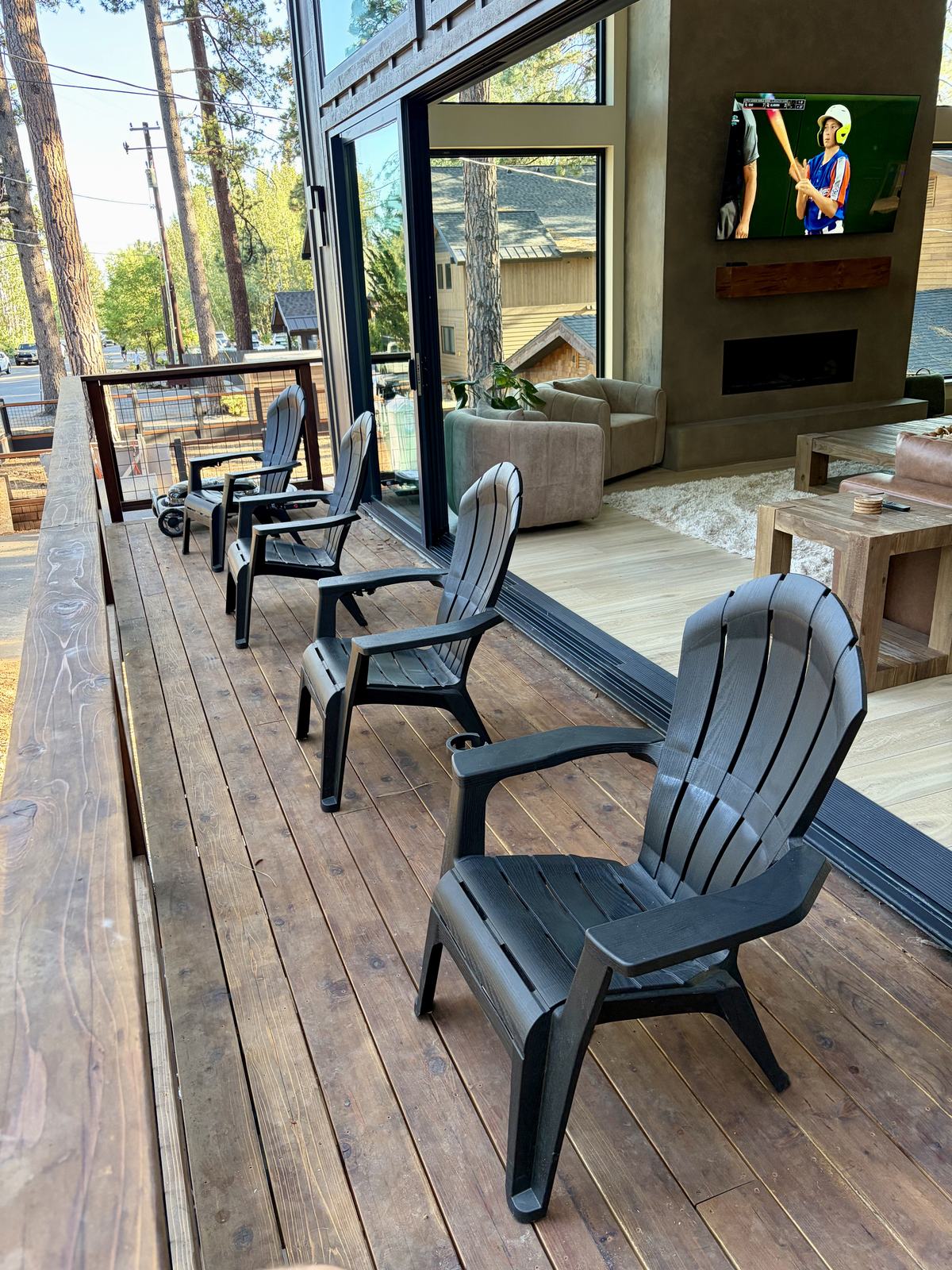 Deck chairs facing the trees with the slider open to the living room