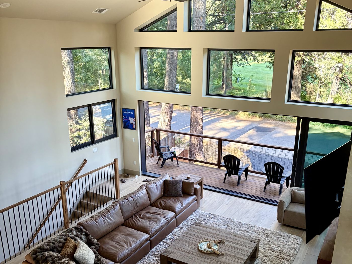 Living room and deck looking out to the Old Brockway golf course through the pines