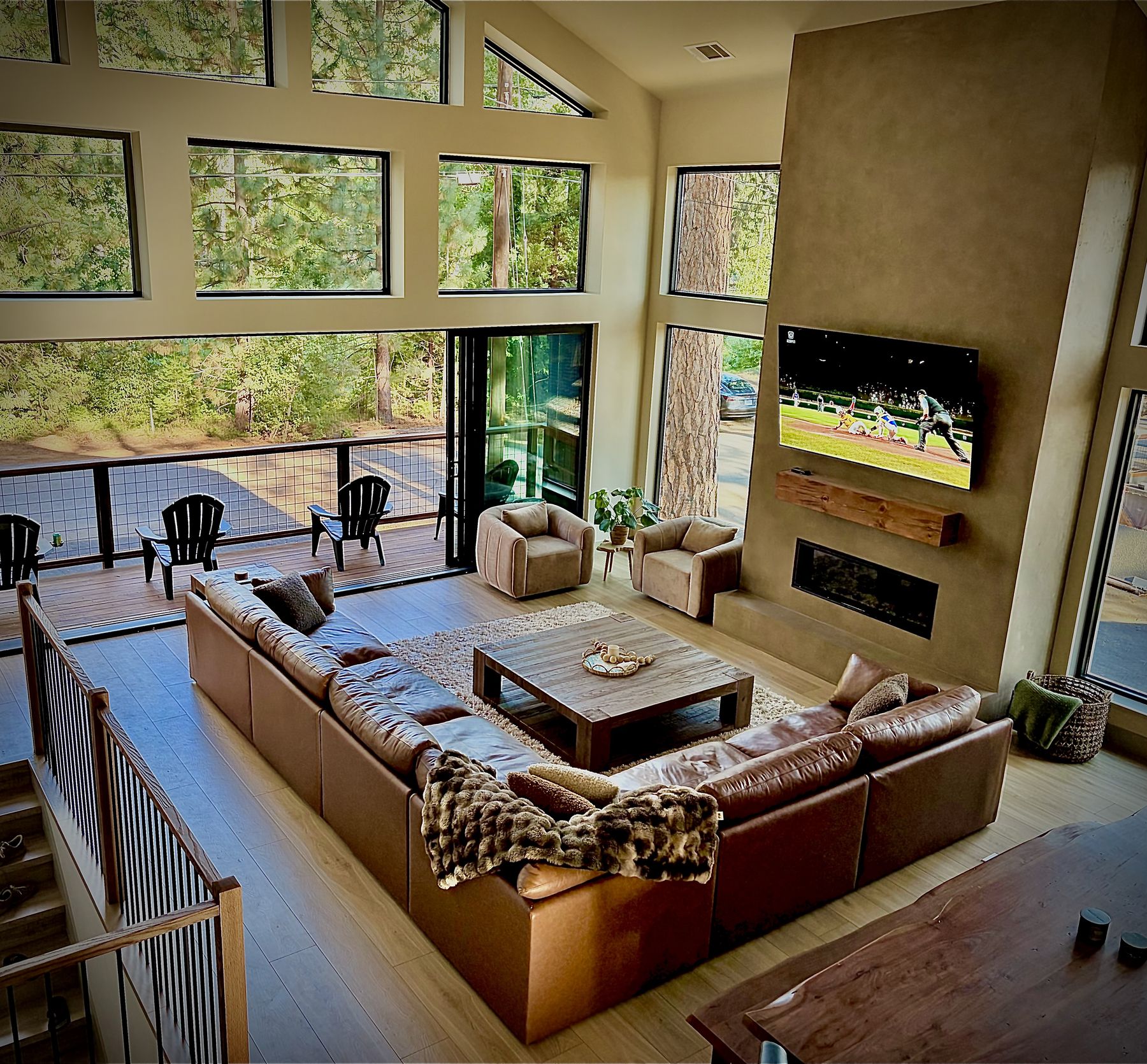 The great room at Ember Pine Retreat opening onto a deck in the pines